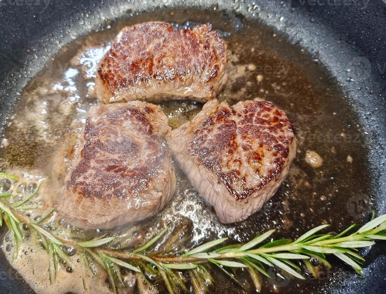 a filet of a beef Steak with herbs and spices photo