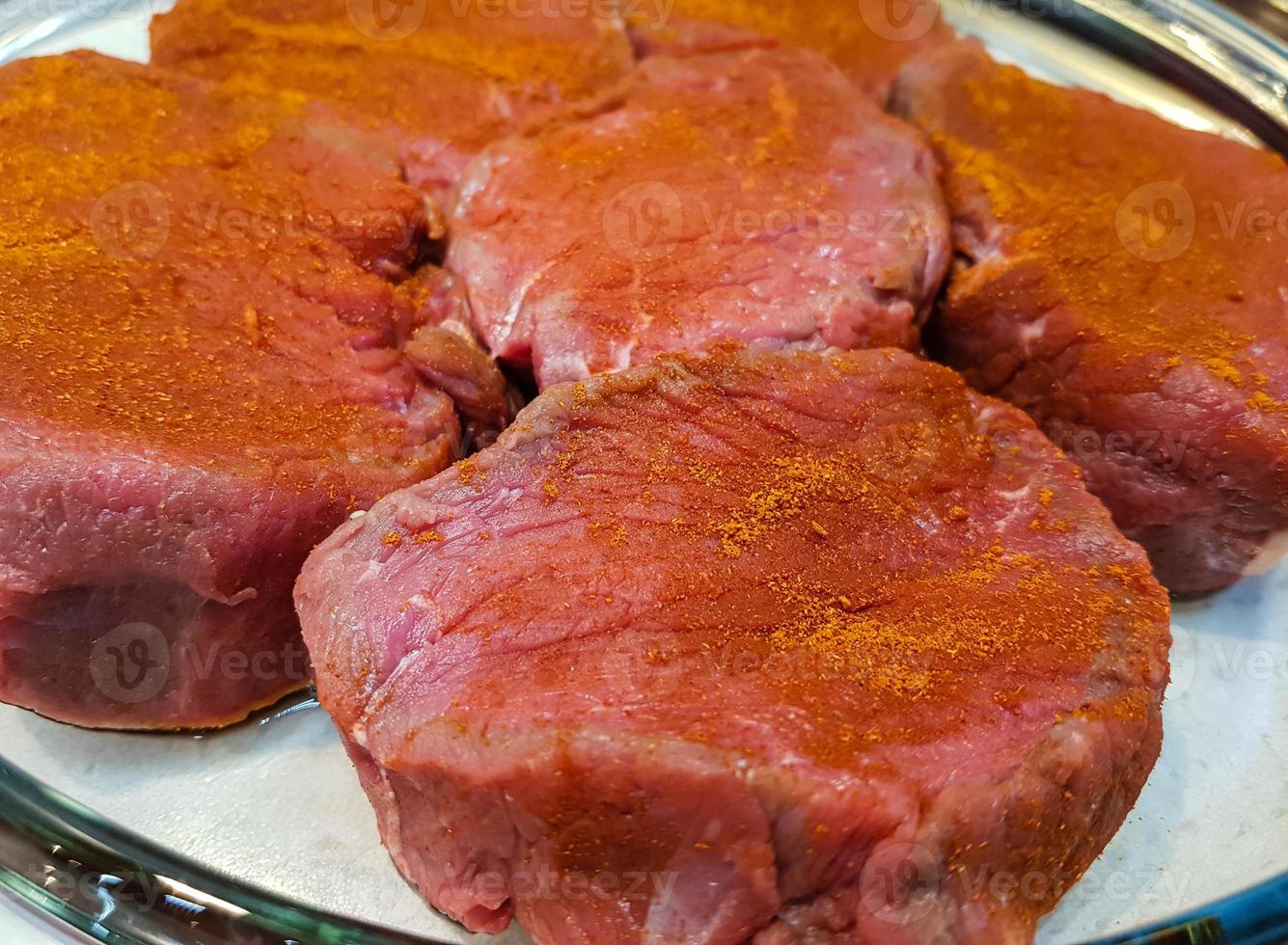 a filet of a beef Steak with herbs and spices photo