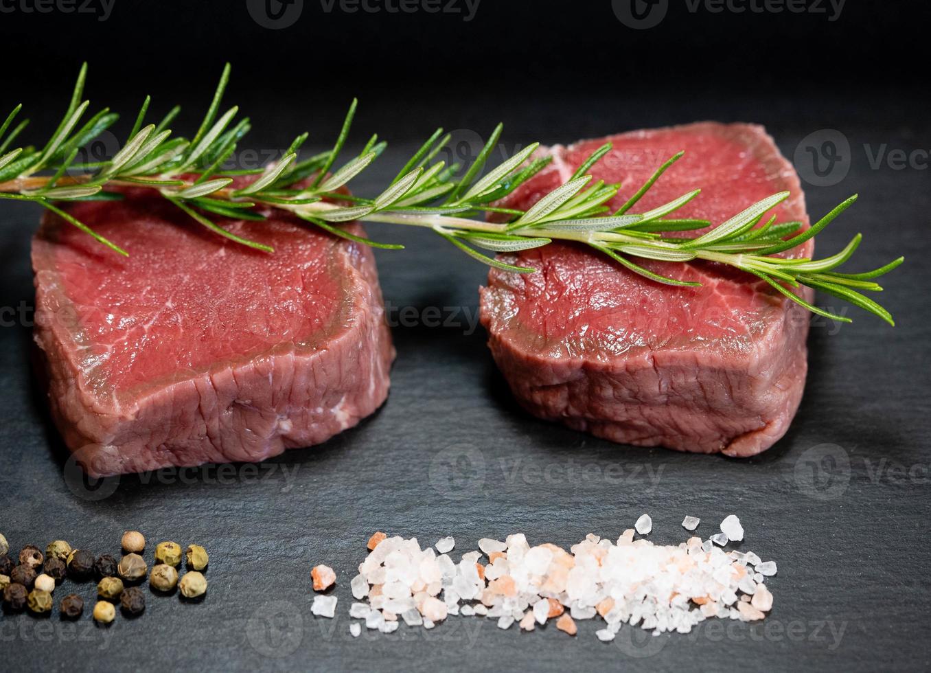 a filet of a beef Steak with herbs and spices photo