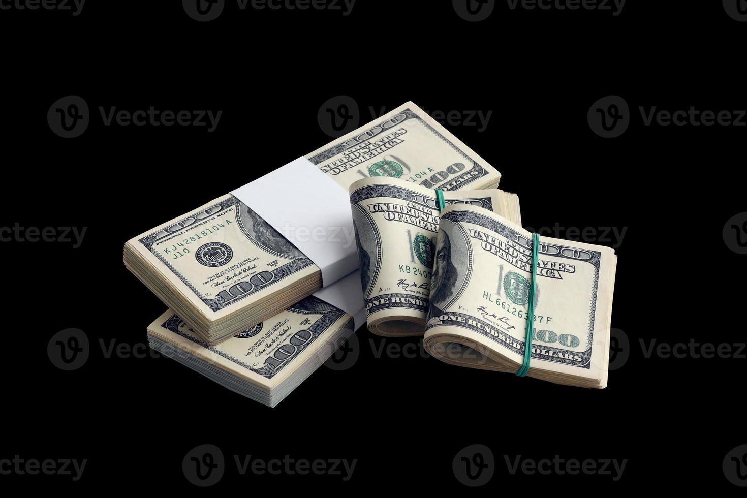 Bundle of US dollar bills isolated on black. Pack of american money with high resolution on perfect black background photo