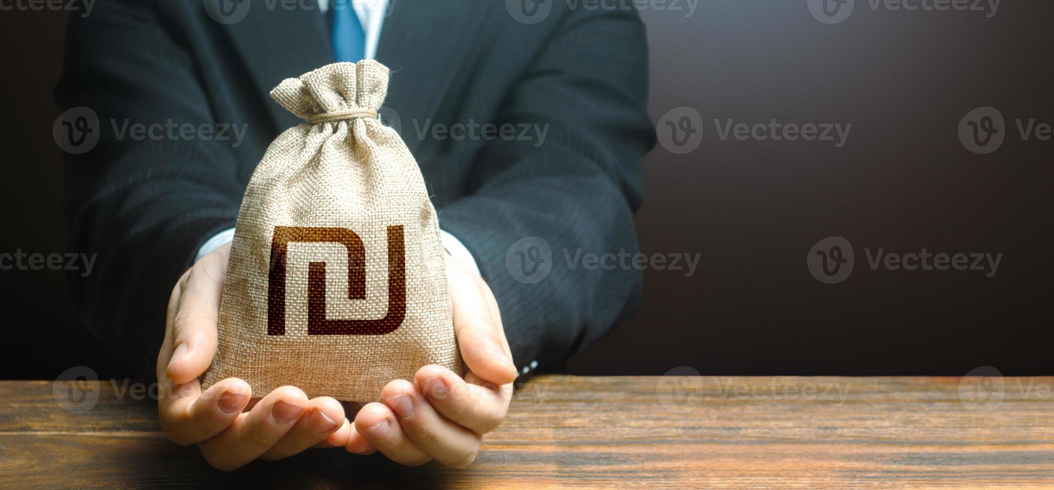 Businessman holds out israeli shekel money bag. Easy Money