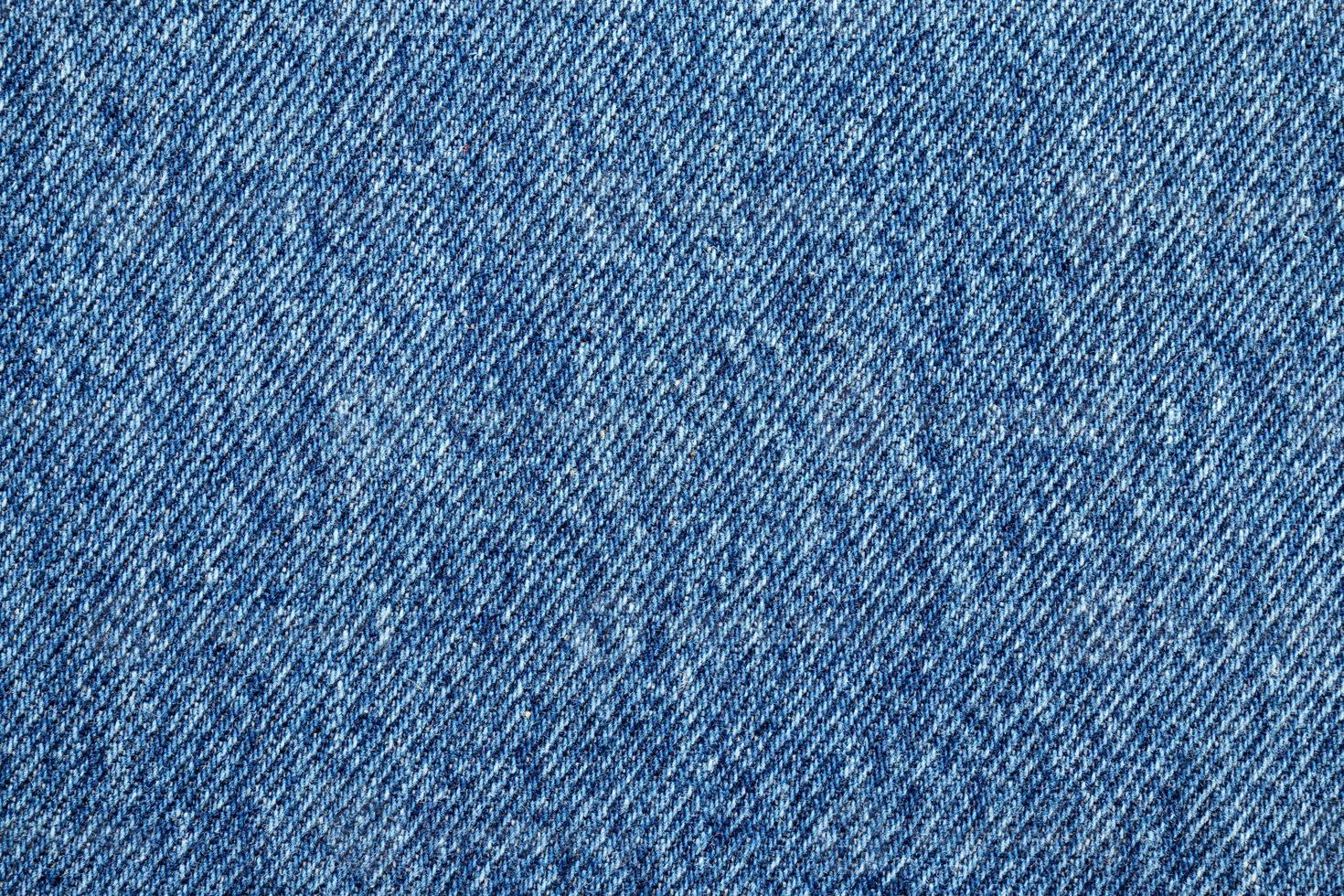 Denim blue jeans texture close up background top view photo