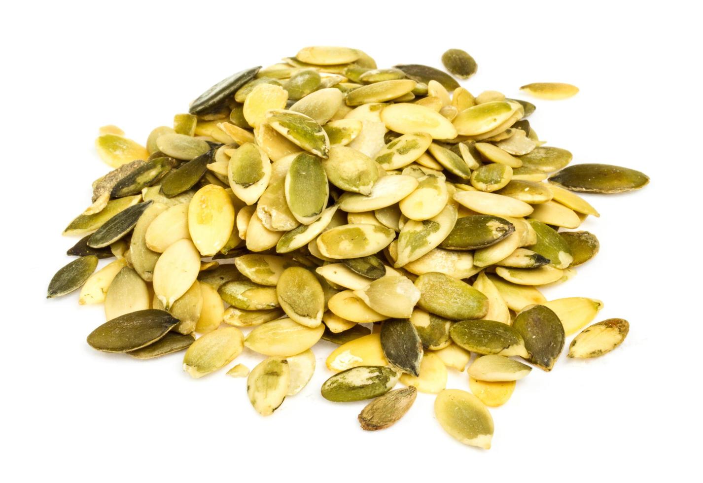 Pumpkin seeds on white photo