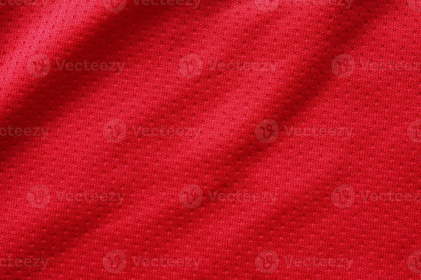 Red sports clothing fabric football shirt jersey texture close up photo