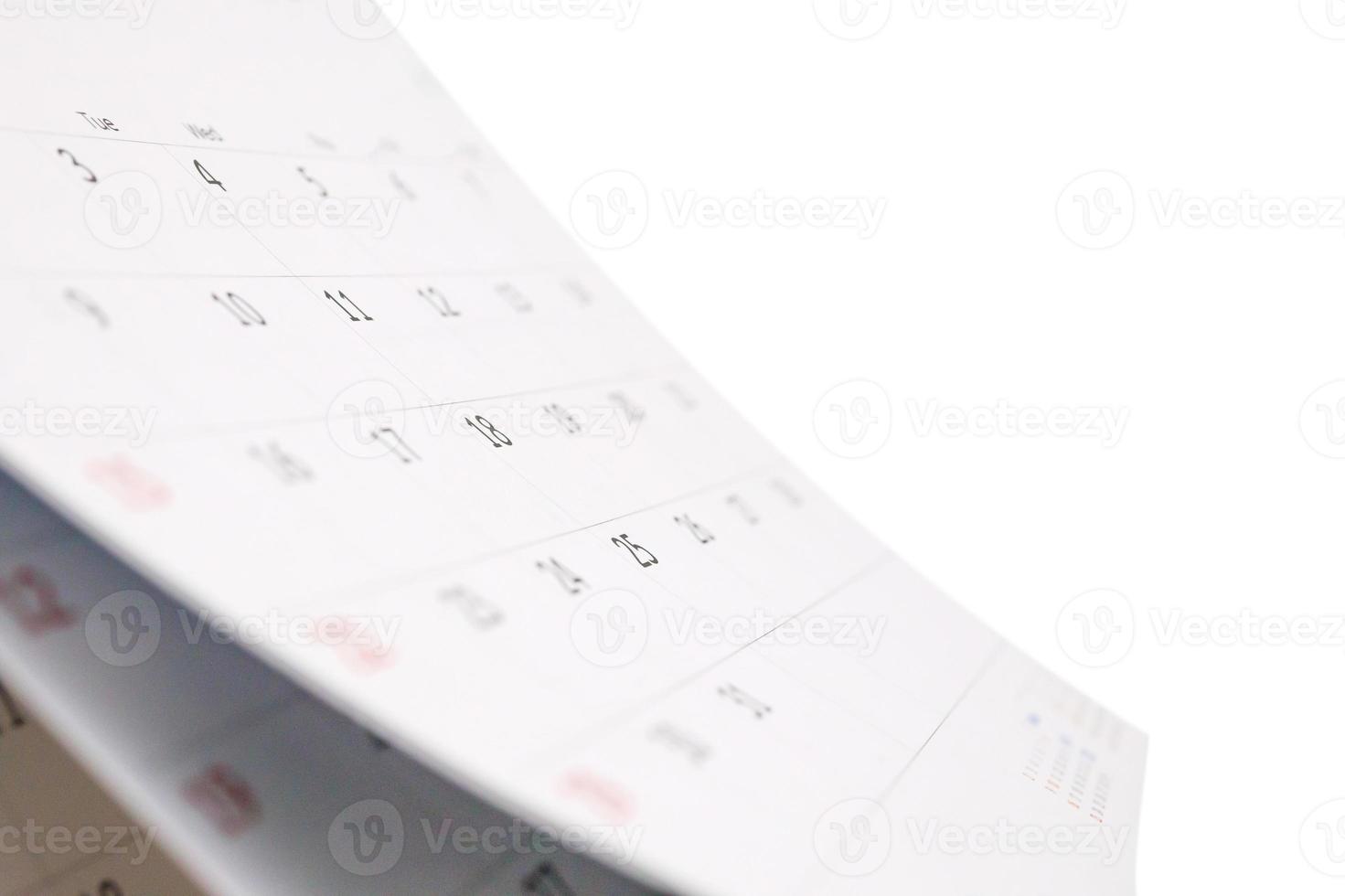 White paper desk calendar isolated on white background photo