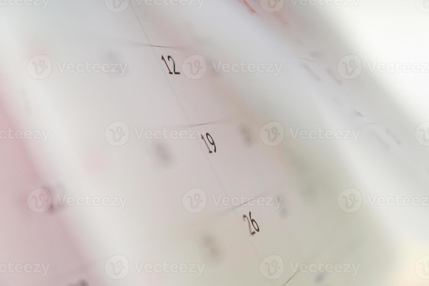 Calendar page flipping sheet close up on office table background business schedule planning appointment meeting concept photo