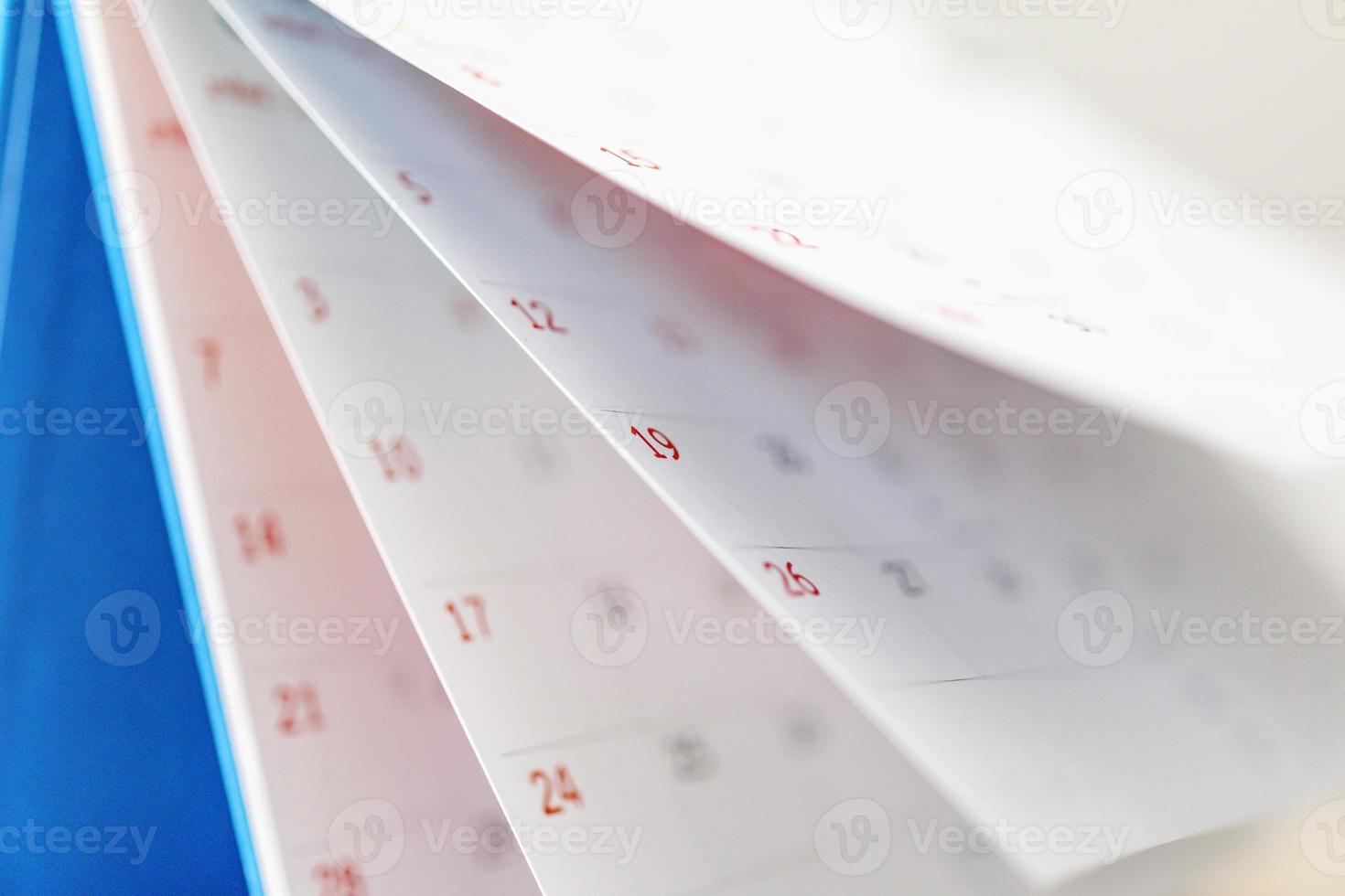 Calendar page flipping sheet close up on office table background business schedule planning appointment meeting concept photo