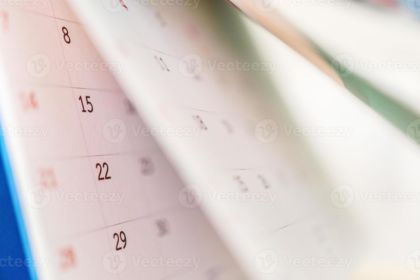 Calendar page flipping sheet close up on office table background business schedule planning appointment meeting concept photo