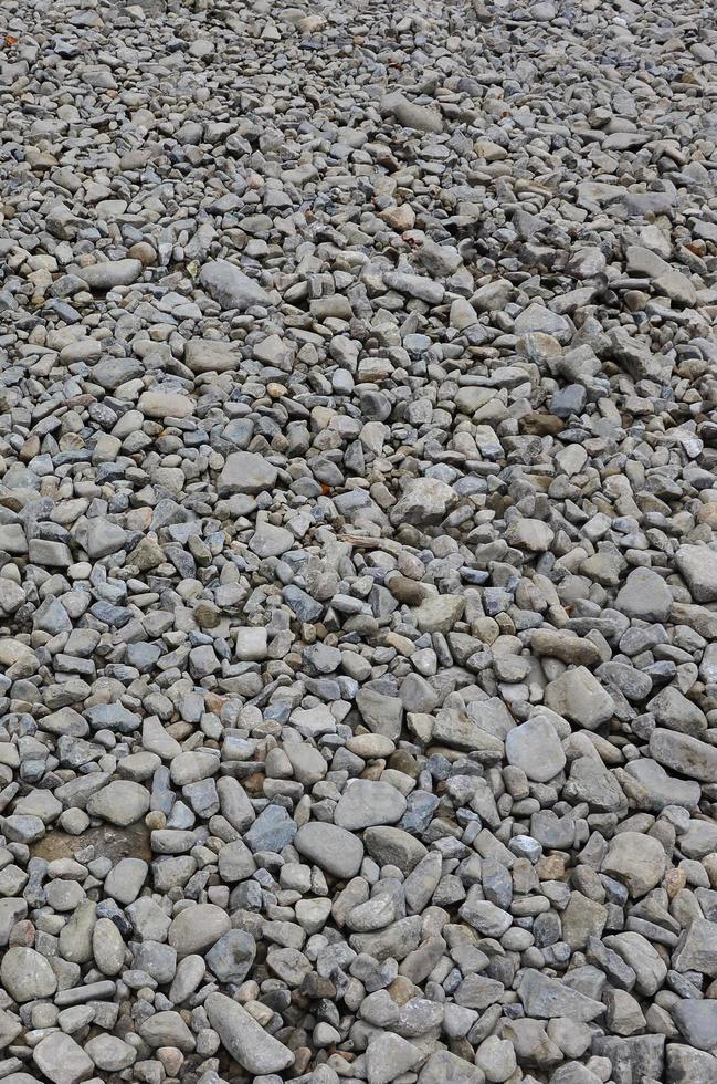 Texture of many crushed stones. Crushed stone is a solid base material for foundation photo