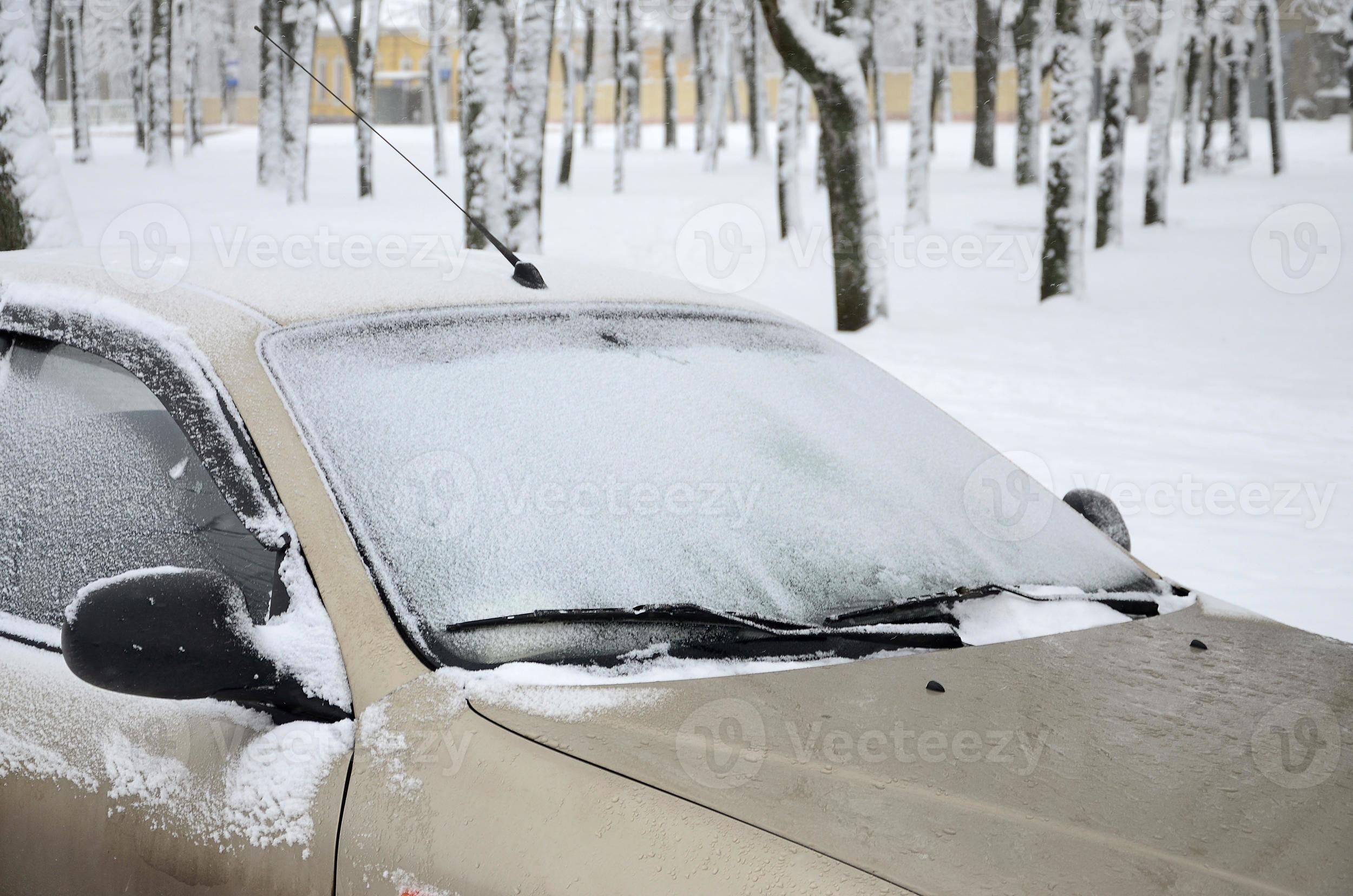 Fragment of the car under a layer of snow after a heavy snowfall. The