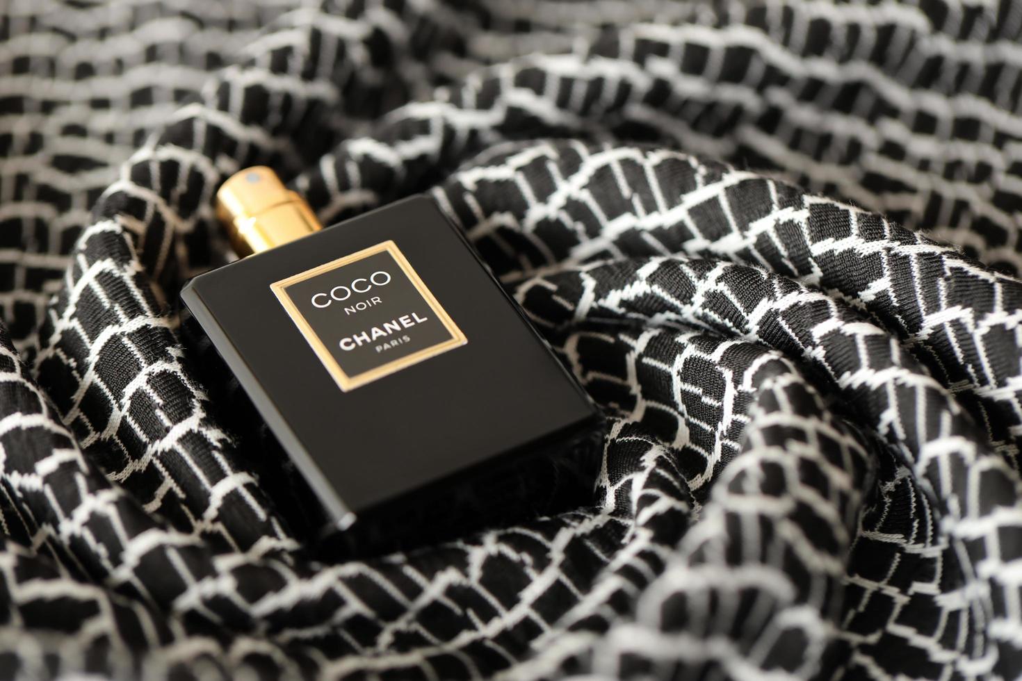 TERNOPIL, UKRAINE - SEPTEMBER 2, 2022 Coco Noir Chanel Paris worldwide  famous french perfume bottle on old plaid with monochrome pattern 12886959  Stock Photo at Vecteezy