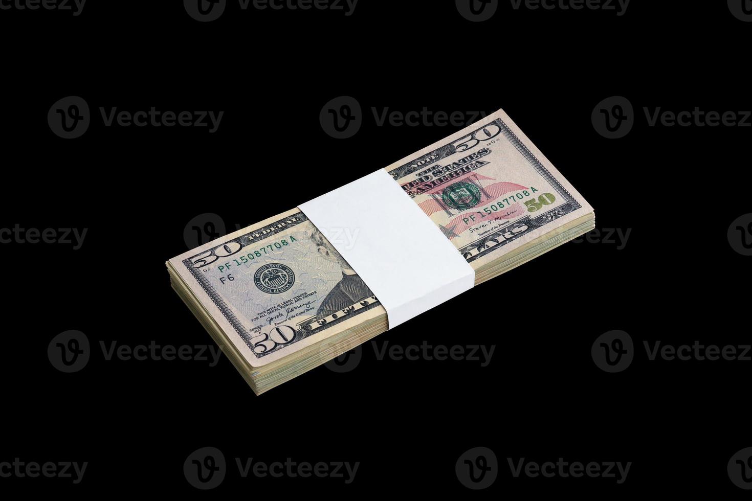 Bundle of US dollar bills isolated on black. Pack of american money with high resolution on perfect black background photo