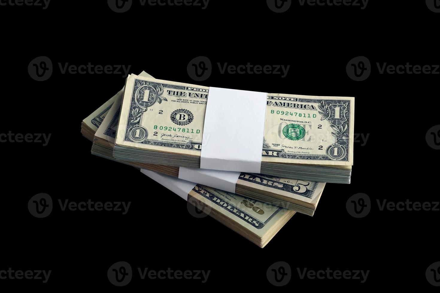 Bundle of US dollar bills isolated on black. Pack of american money with high resolution on perfect black background photo