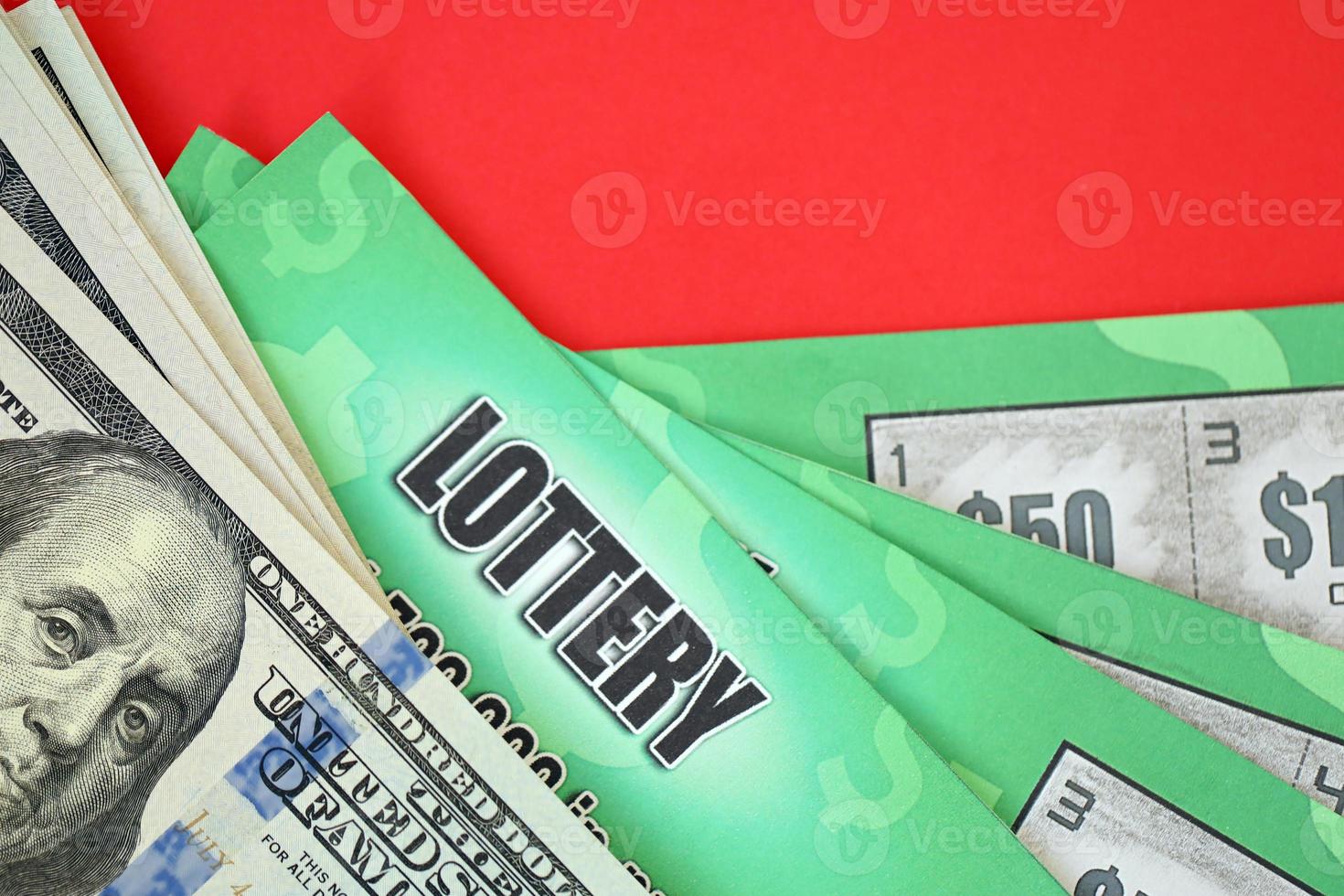 Close up view of green lottery scratch cards and us dollar bills. Many used fake instant lottery tickets with gambling results. Gambling addiction photo