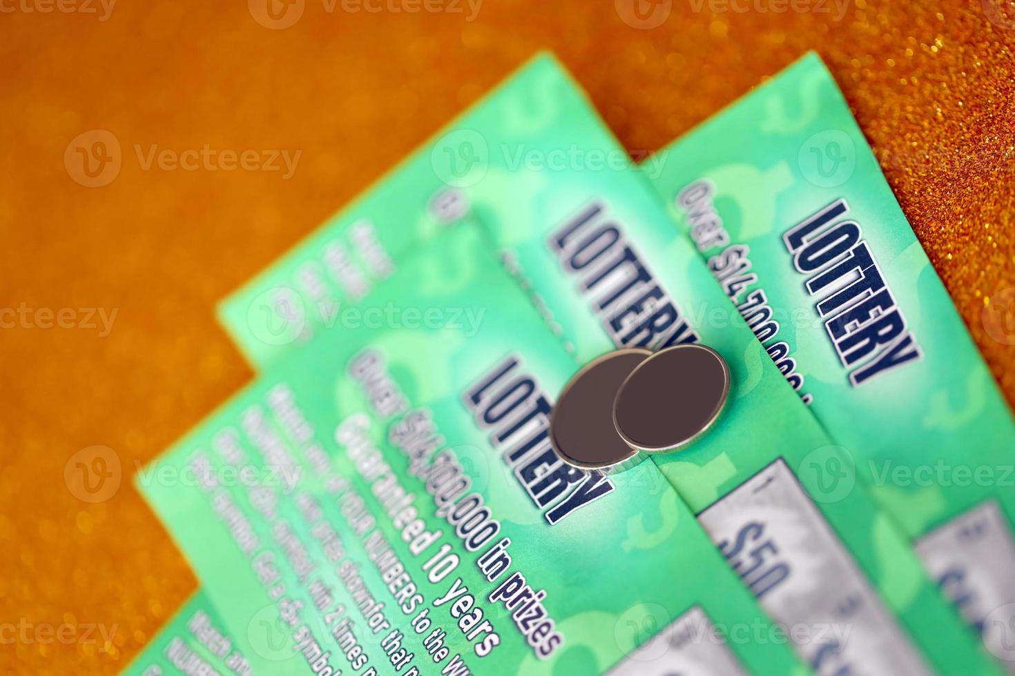 Close up view of green lottery scratch cards. Many used fake instant lottery tickets with gambling results. Gambling addiction photo