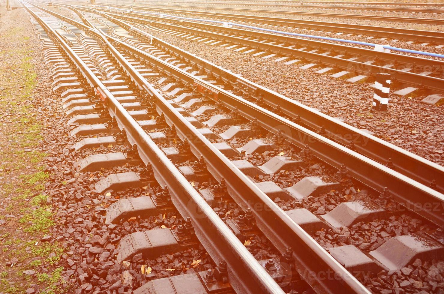 Photo fragment of the railroad tracks in the rainy weather