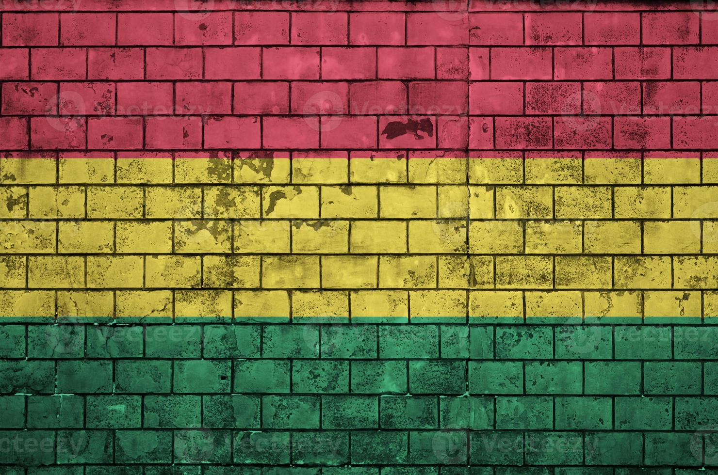 Bolivia flag is painted onto an old brick wall photo