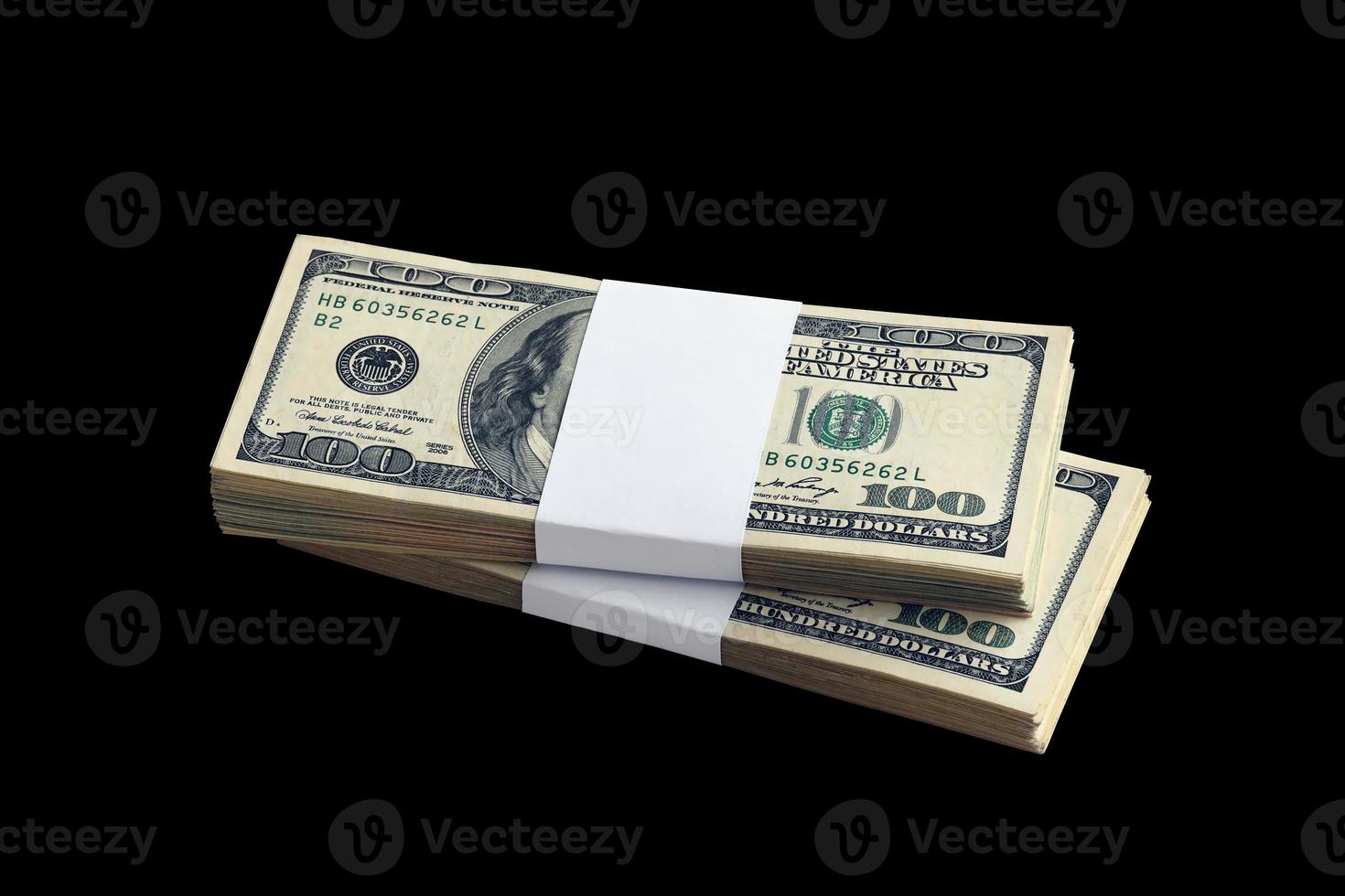 Bundle of US dollar bills isolated on black. Pack of american money with high resolution on perfect black background photo