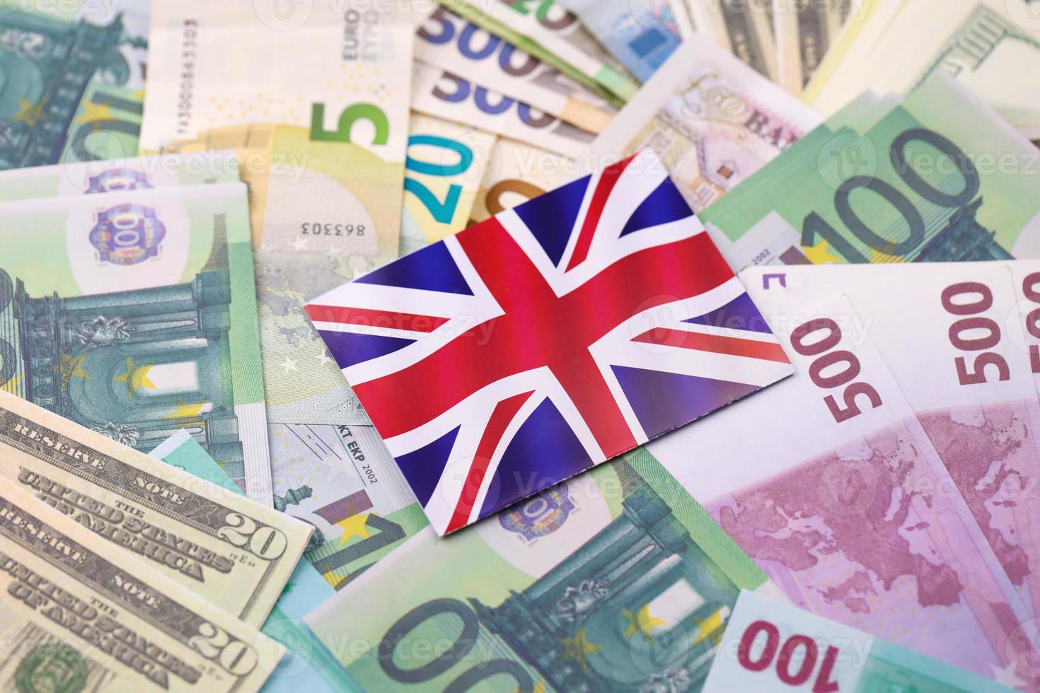 GB Flag with euro and dollar money bills close up. Big amount of money and England union jack. International business in Great Britain concept photo