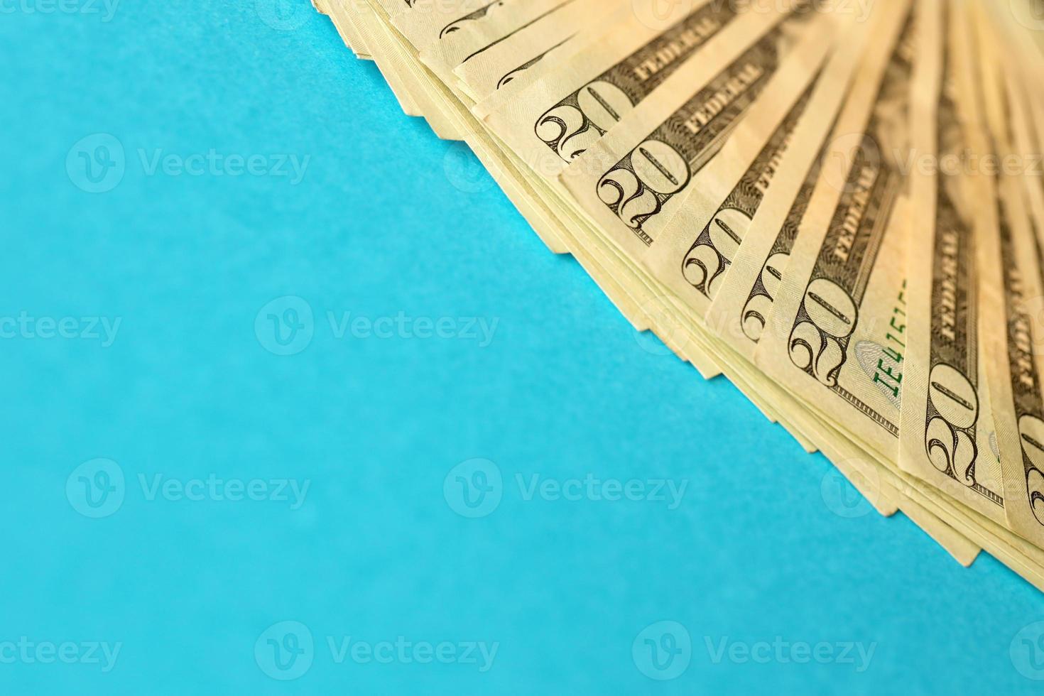 Big amount of old twenty dollar bills on blue background money