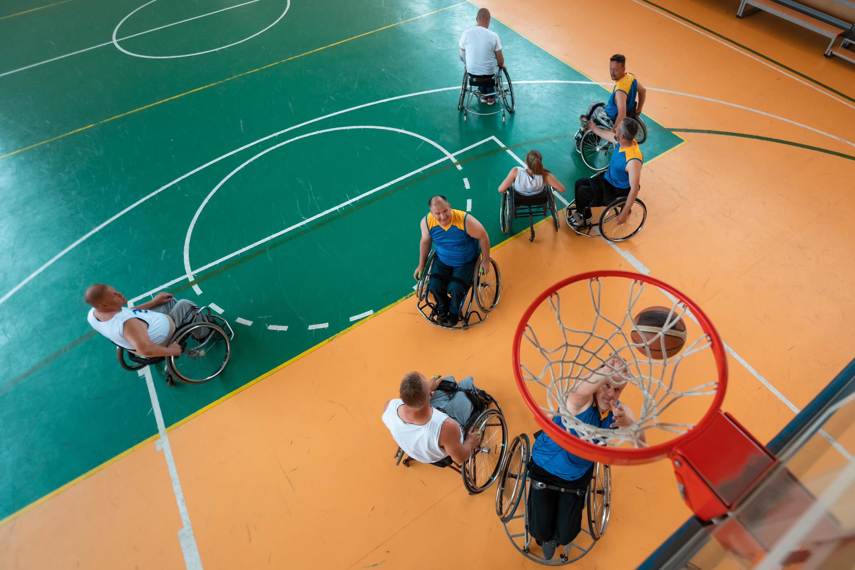 Disabled War or work veterans mixed race and age basketball teams in