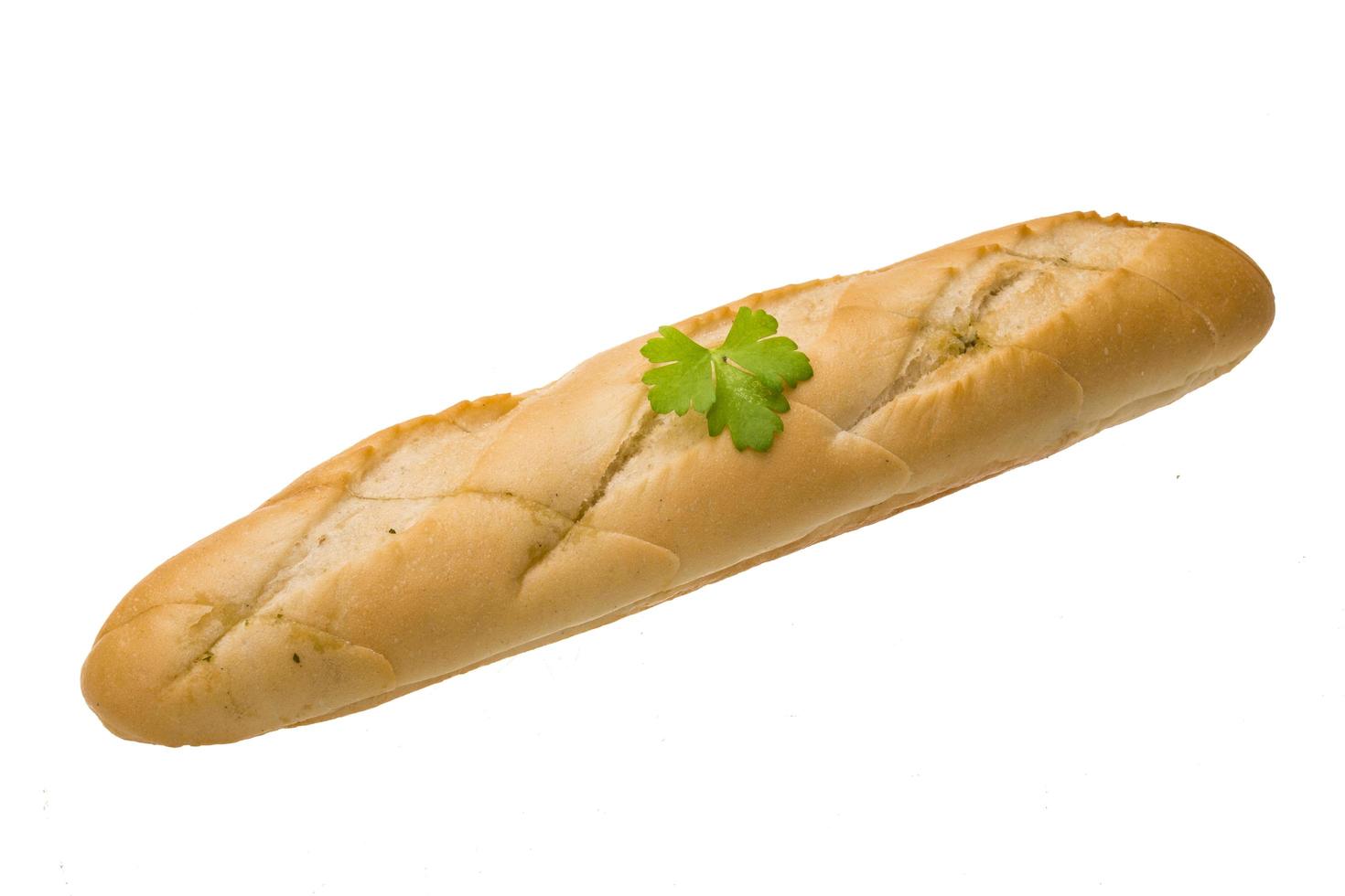 Fresh baguette on white photo