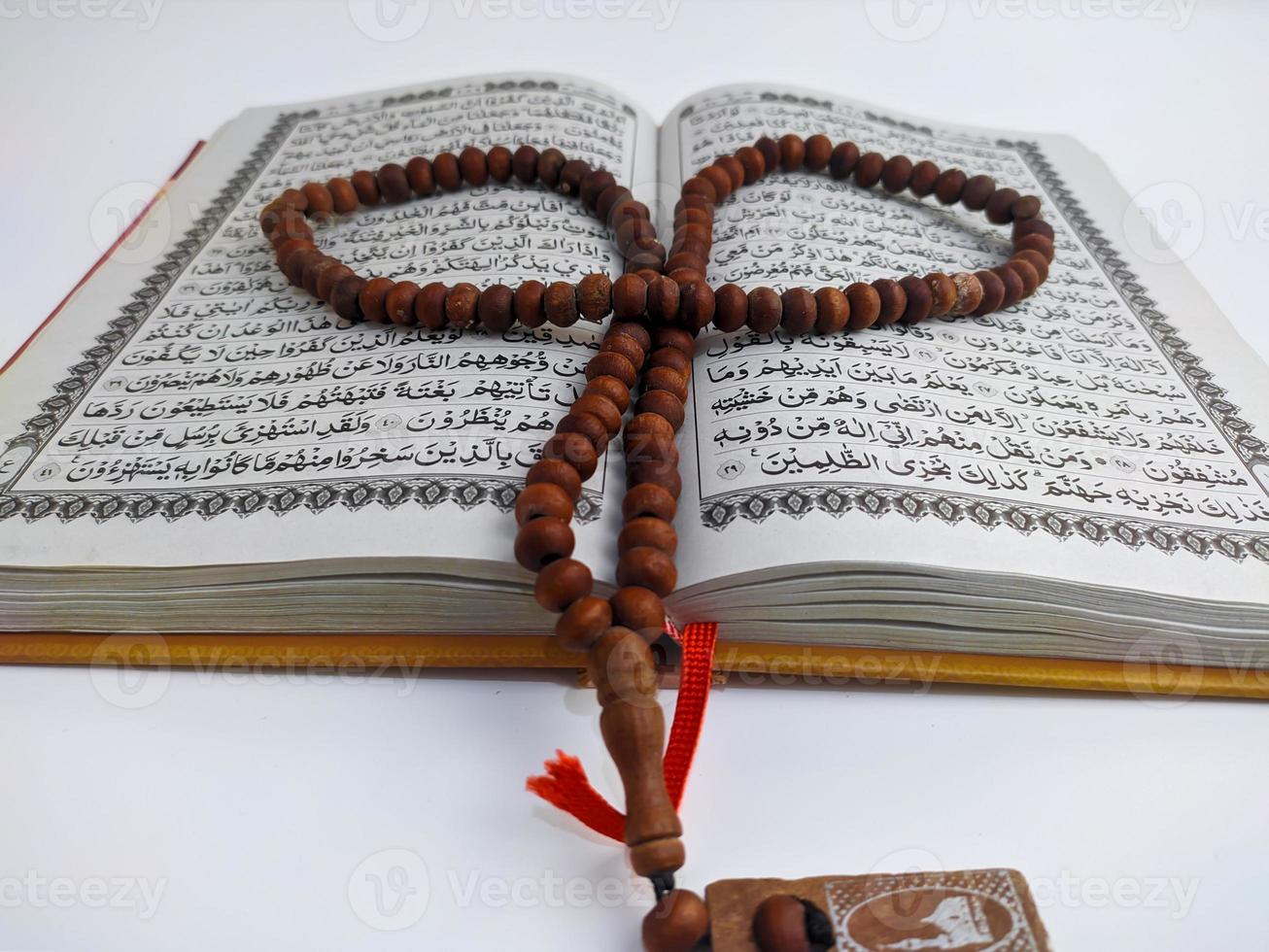 Islamic concept - The Holy Al Quran, on white background, with copy space photo