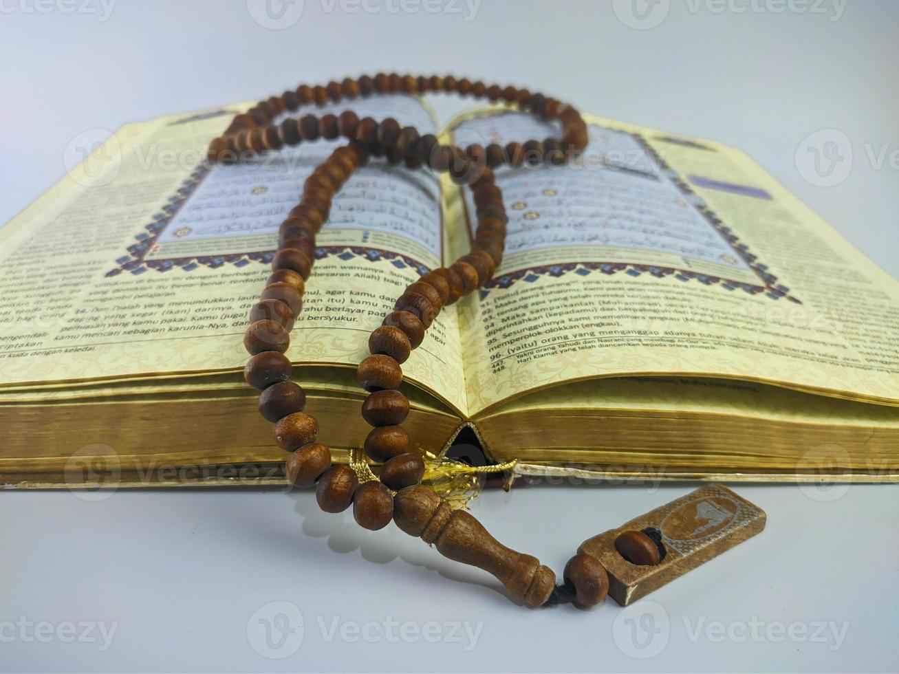 Islamic concept - The Holy Al Quran, on white background, with copy space photo