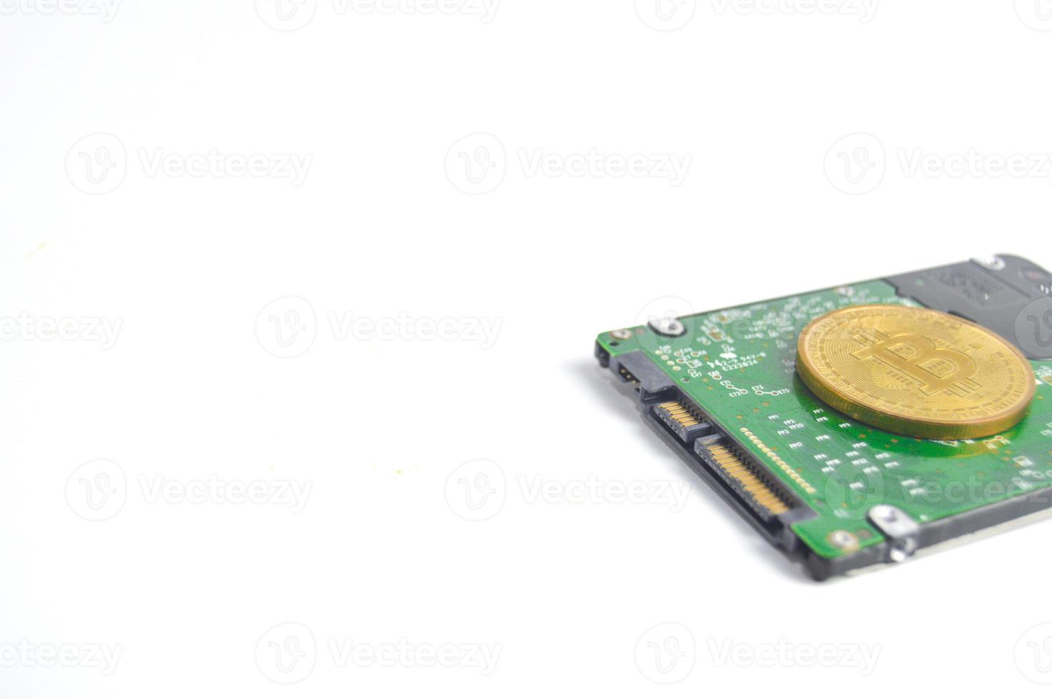 Computer hard drive and bitcoin crypto isolated on white background photo