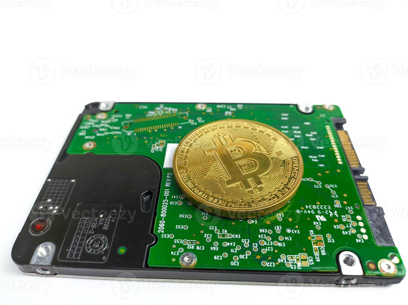 Computer hard drive and bitcoin crypto isolated on white background photo