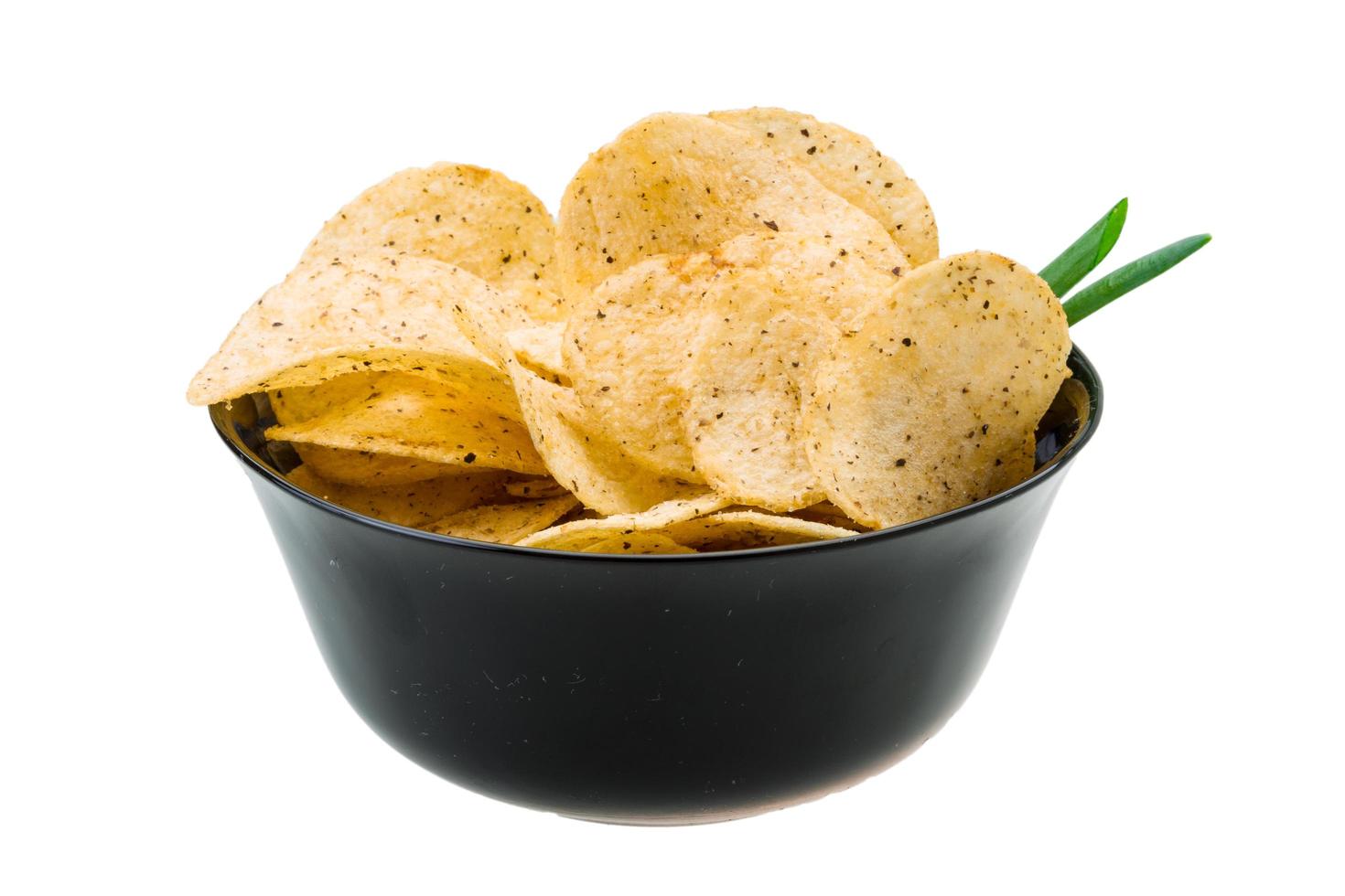 Potato chips in a bowl on white background photo