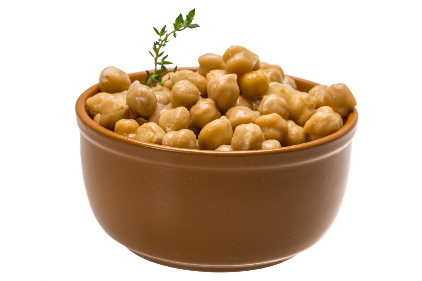 Chickpea in a bowl on white background photo