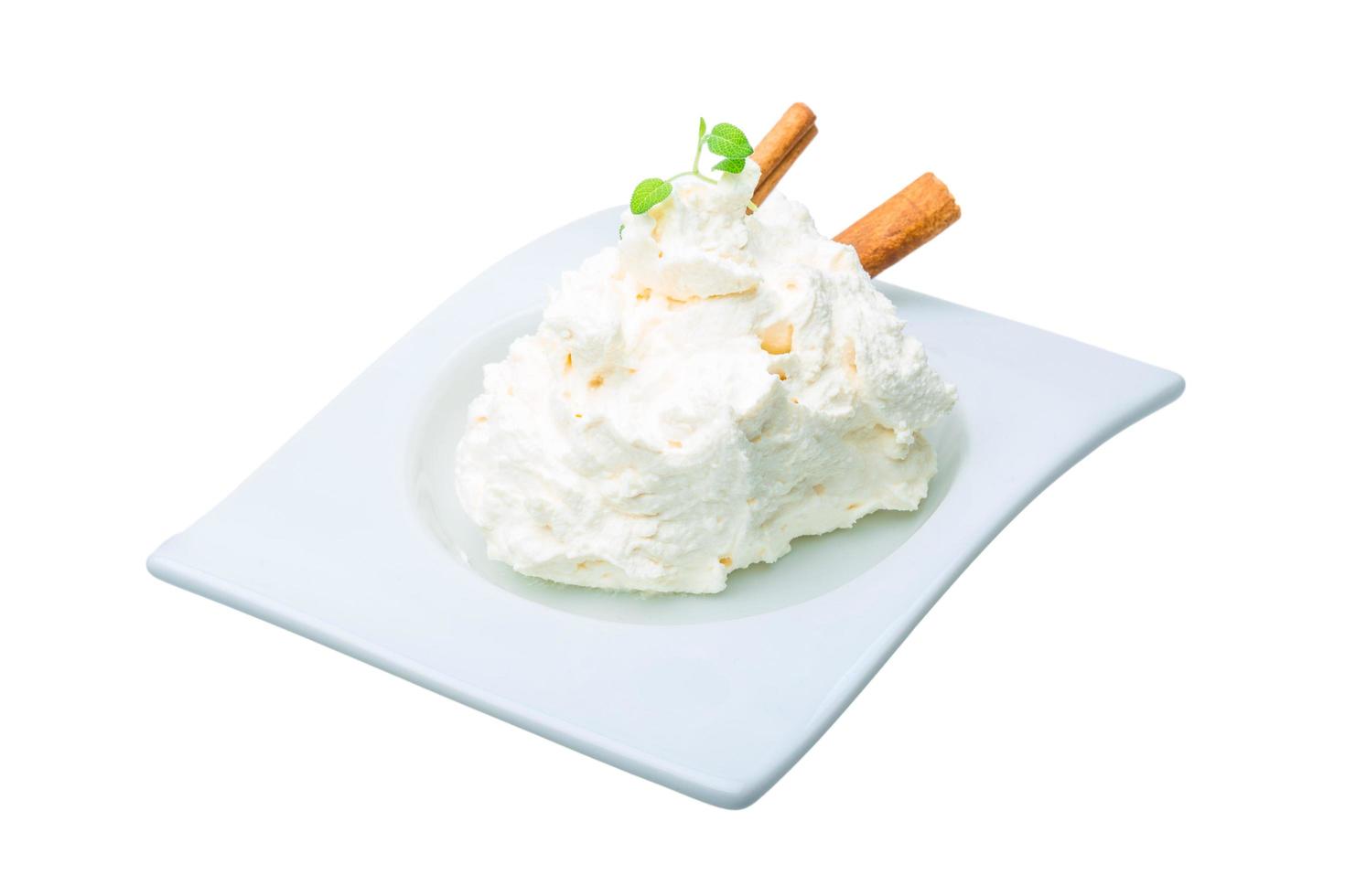 Cottage cheese in a bowl on white background photo