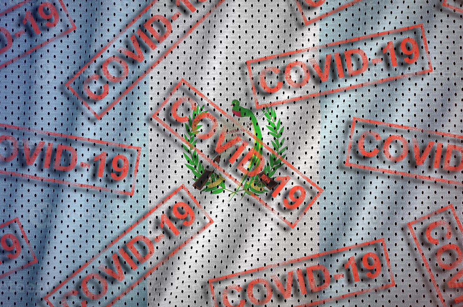 Guatemala flag and many red Covid-19 stamps. Coronavirus or 2019-nCov virus concept photo