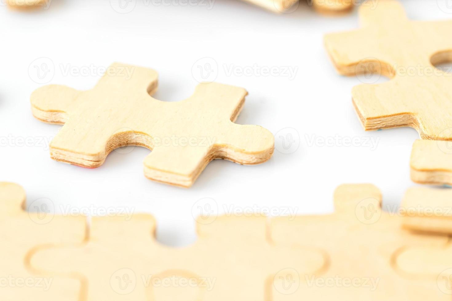 Blank wooden jigsaw puzzle photo