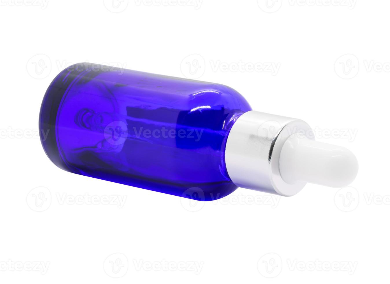 Blue glass dropper serum bottle on white background photo