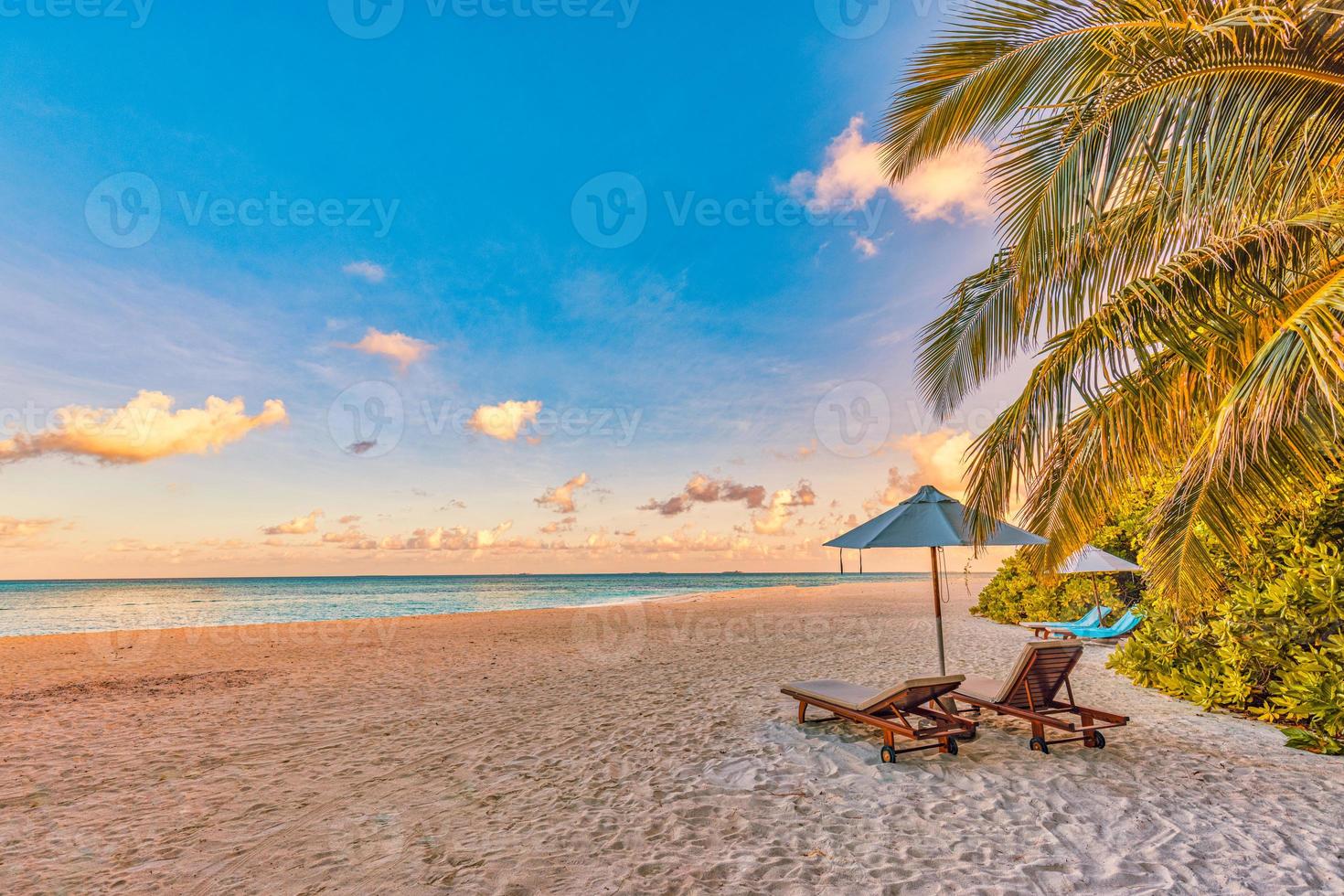 Amazing beach. Chairs on the sandy beach sea. Luxury summer holiday vacation resort as tourism design. Panoramic tropical landscape. Tranquil scenery, relaxing beach, romantic couple paradise panorama photo