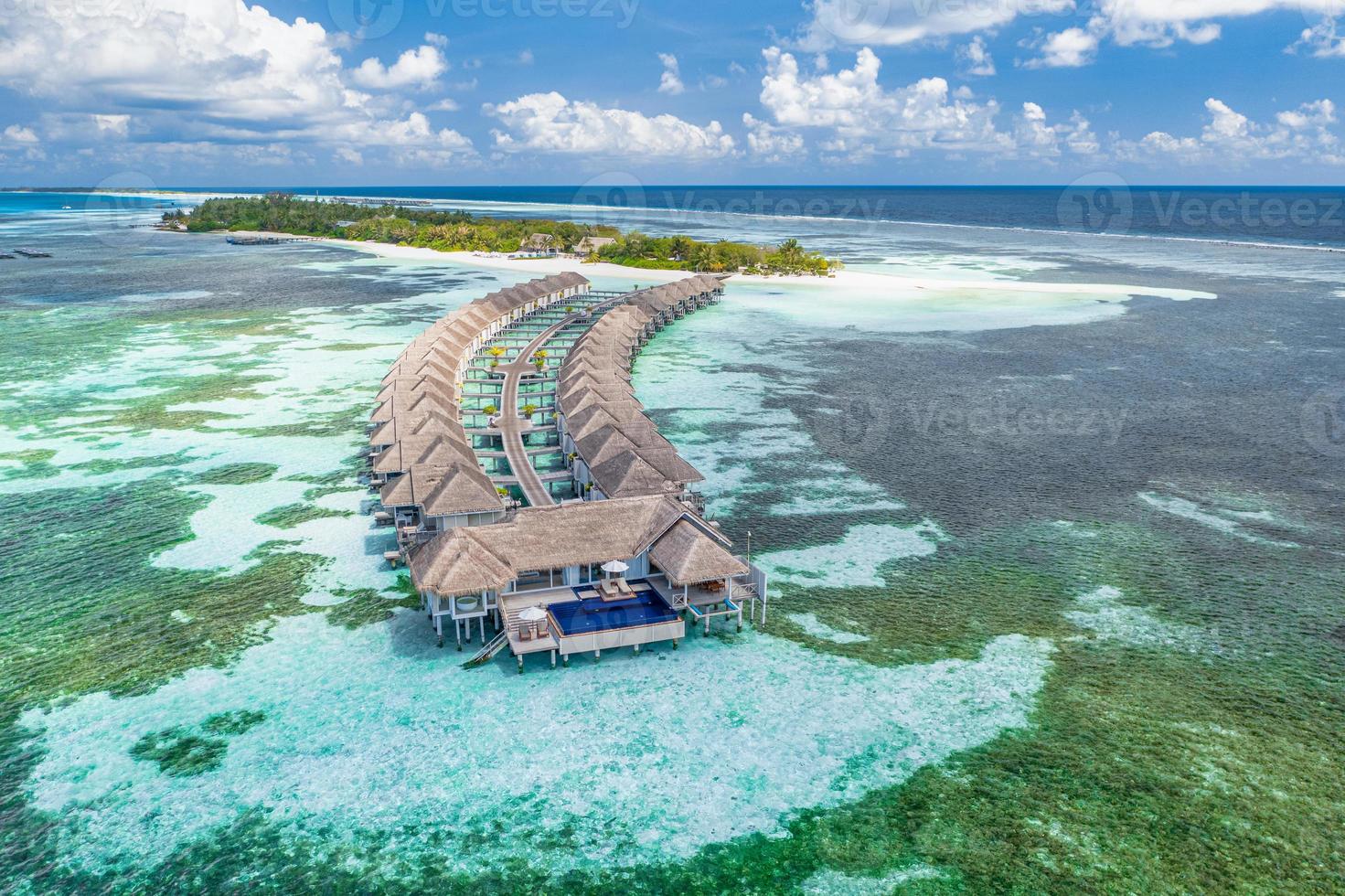 Amazing island beach. Maldives from aerial view tranquil tropical landscape seaside with palm trees on white sandy beach. Exotic nature shore, luxury resort island. Beautiful summer holiday tourism photo