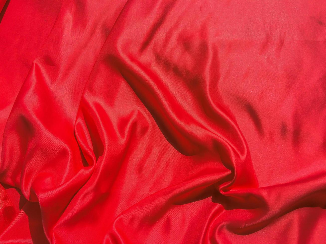 Red fabric texture for backgroundwith coy space. Valentines Day or Christmas Day wallpaper design photo