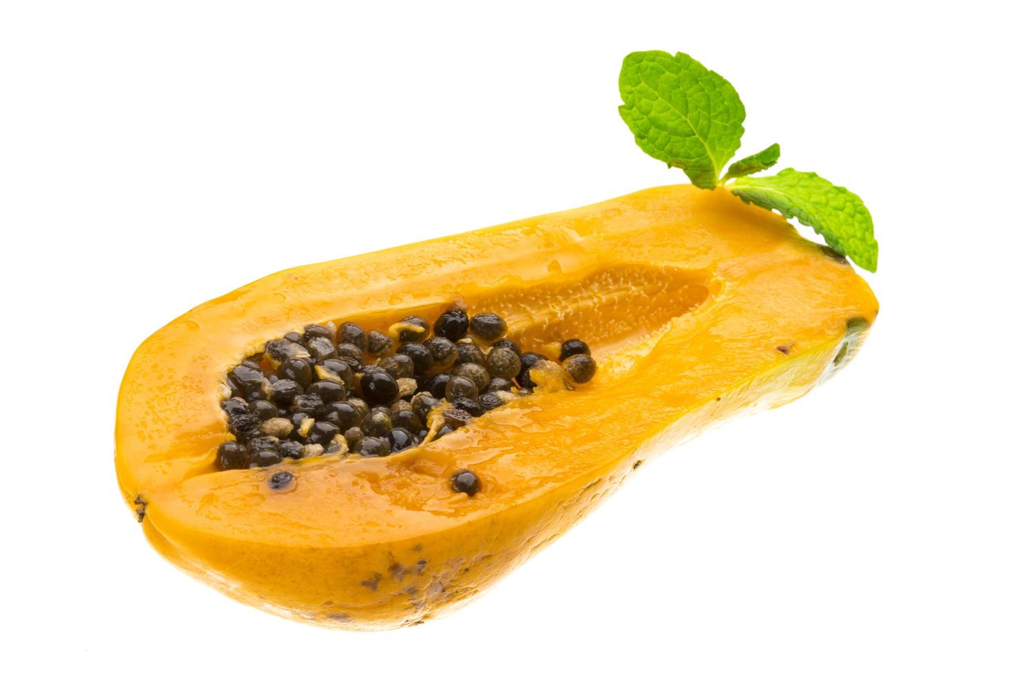 Ripe papaya on white background photo