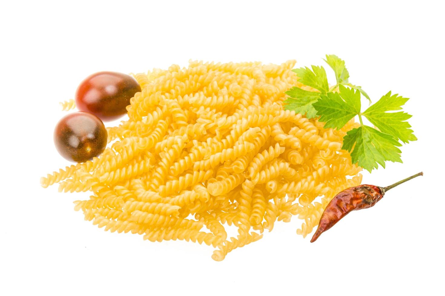 Raw macaroni on white background photo