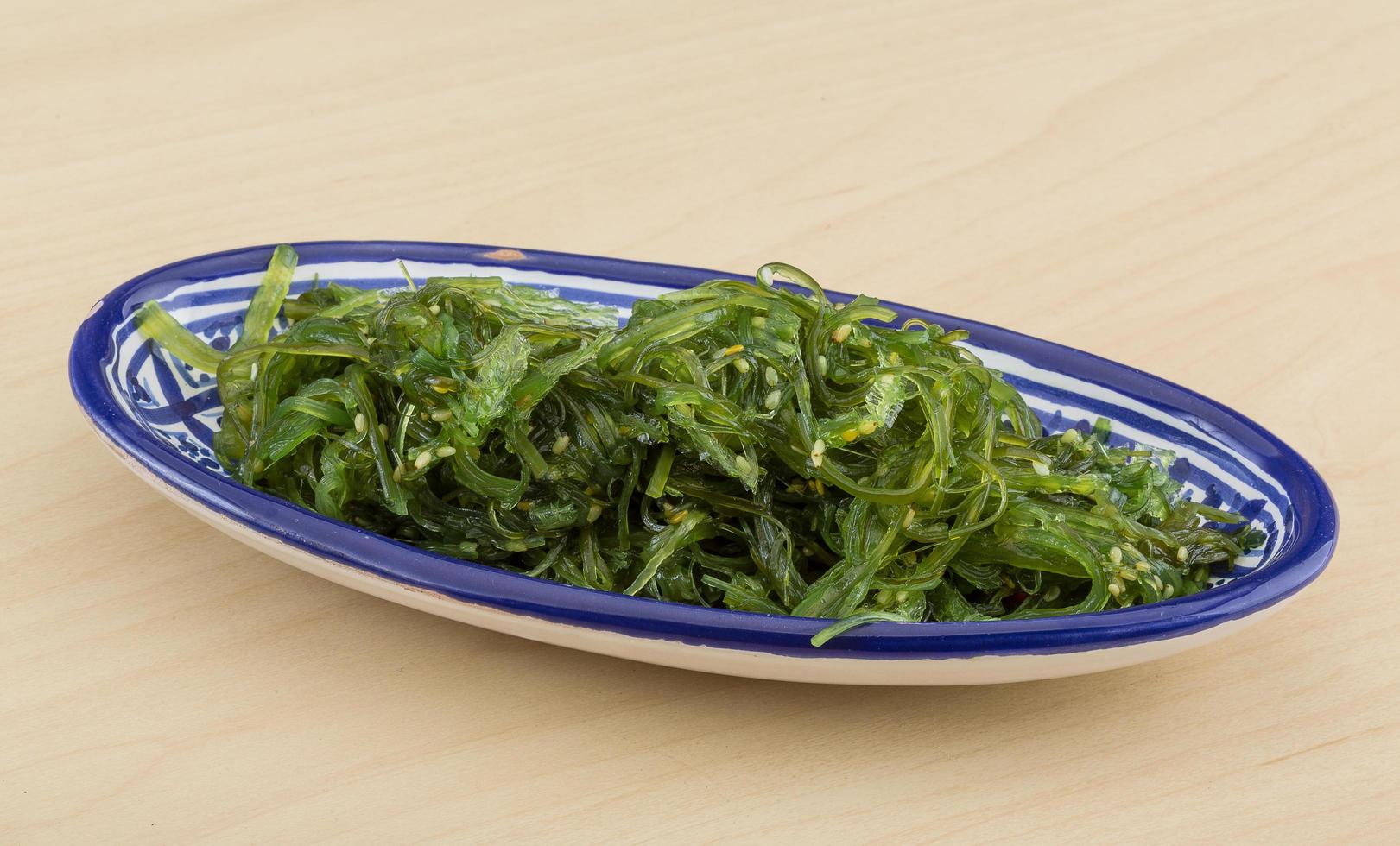 Chuka salad in a bowl on wooden background photo