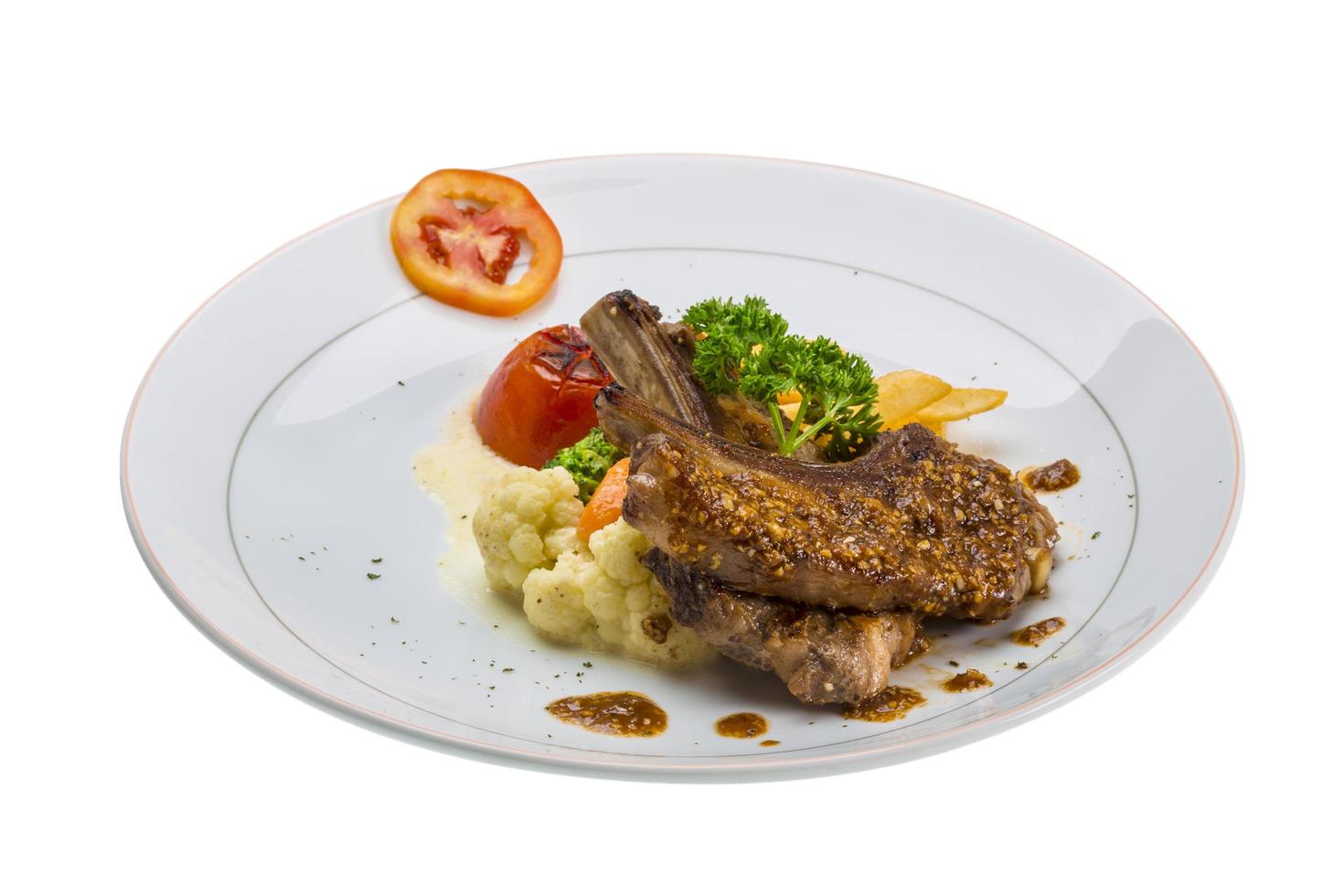 Lamb chops on white photo