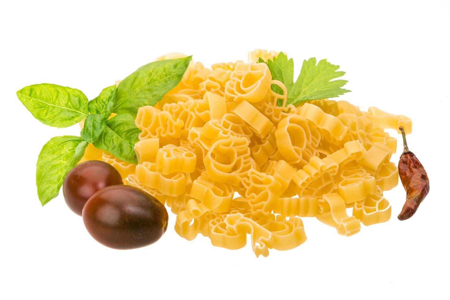 Raw macaroni on white background photo