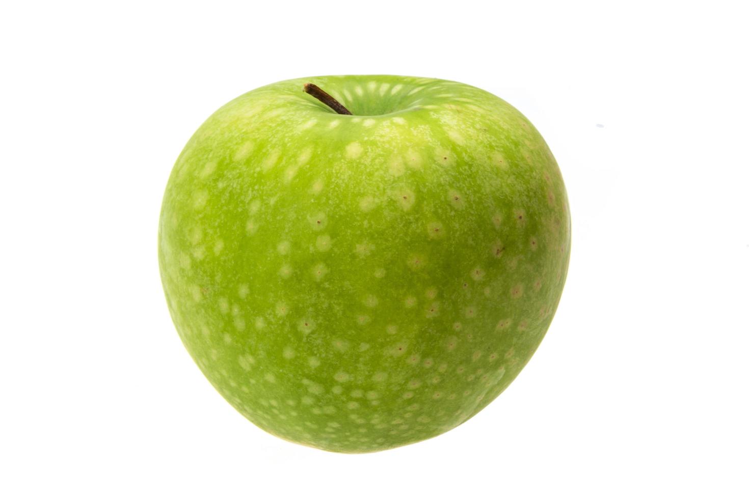 Green apple on white photo