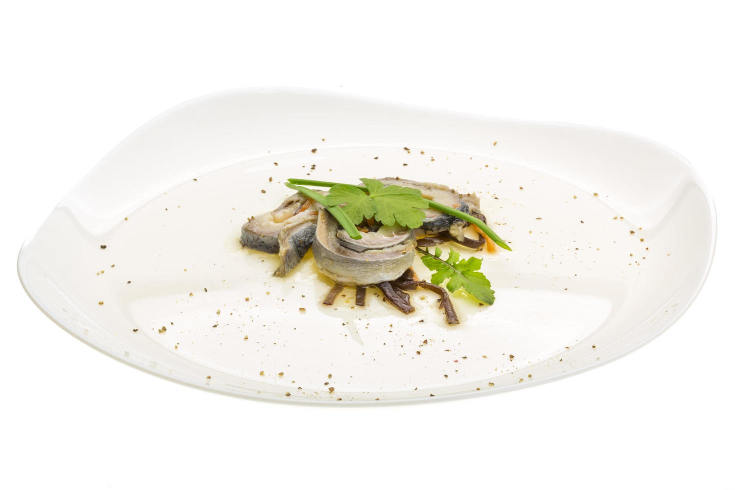 Herring fillet on the plate and white background photo