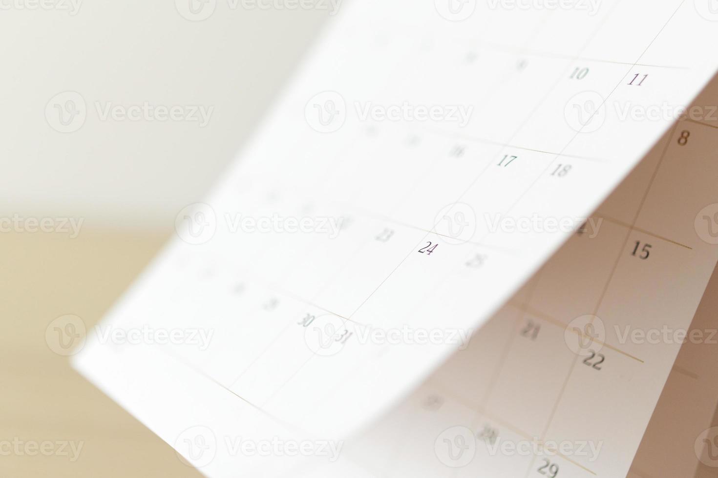 página del calendario hoja de volteo primer plano fondo borroso horario de negocios planificación cita reunión concepto foto