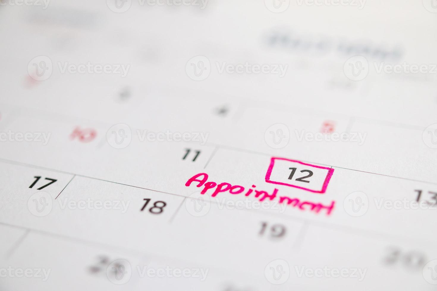 important appointment schedule write on white calendar page date close up photo