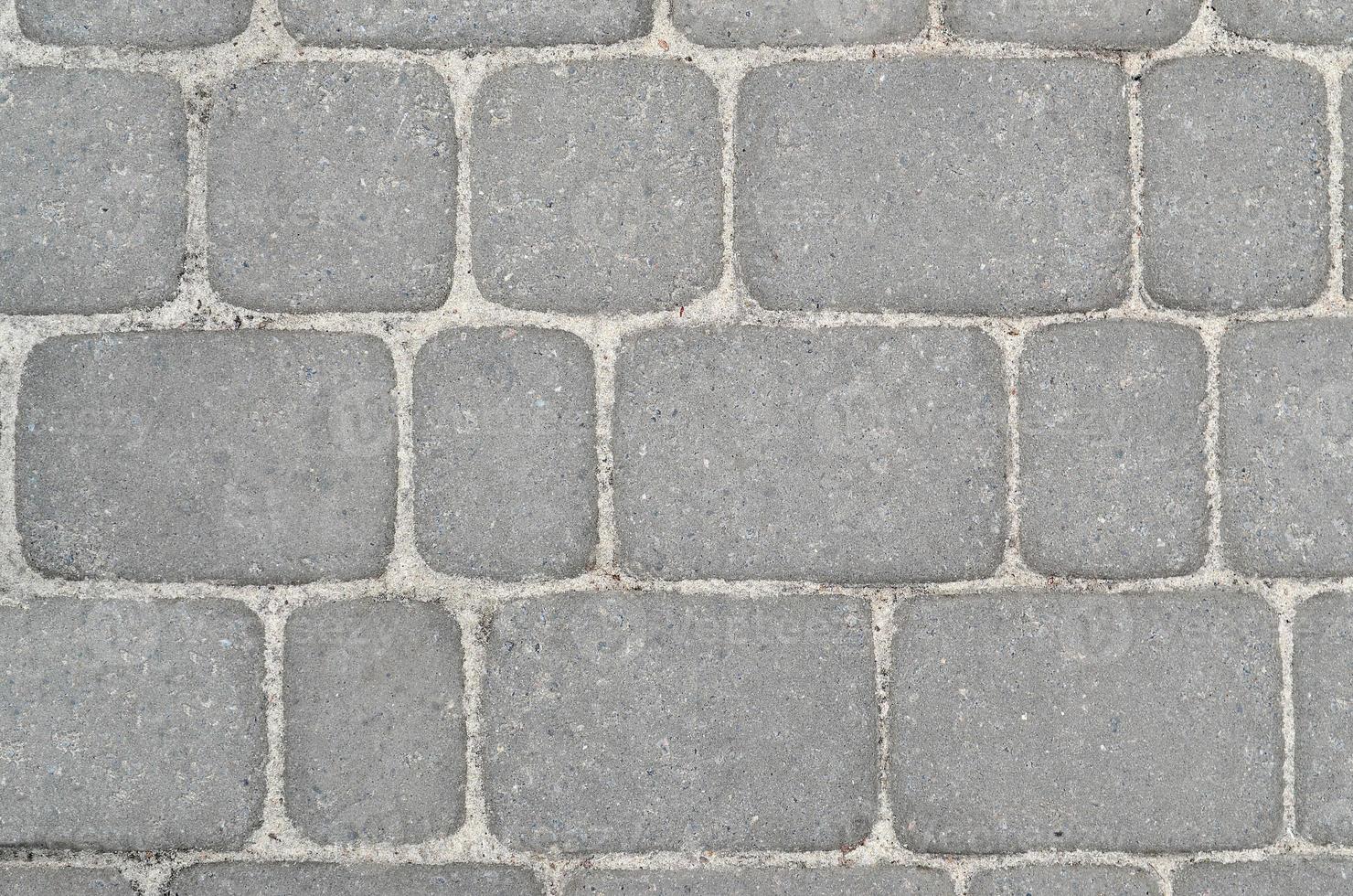 Fragment of the road laid out of the paving stone photo