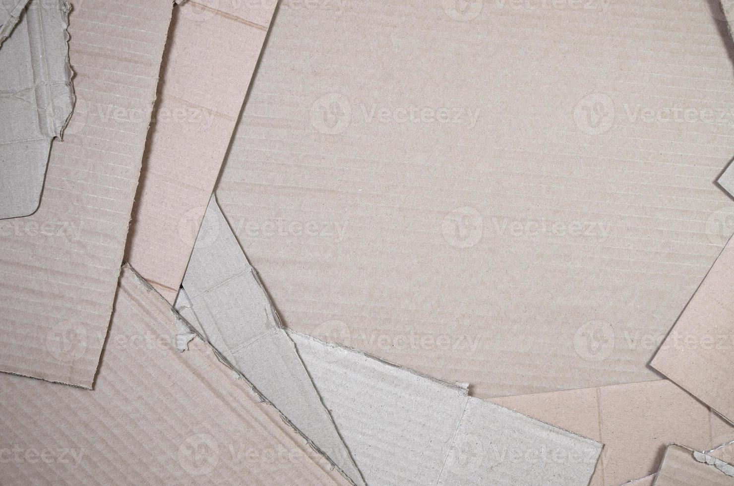 Background image with a lot of beige cardboard paper, which is used to make boxes for the transport of home appliances and postal parcels. Carton texture photo